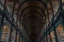 The Long Room of Trinity College's Old Library, with its dark wooden barrel vault and tall shelves of old books