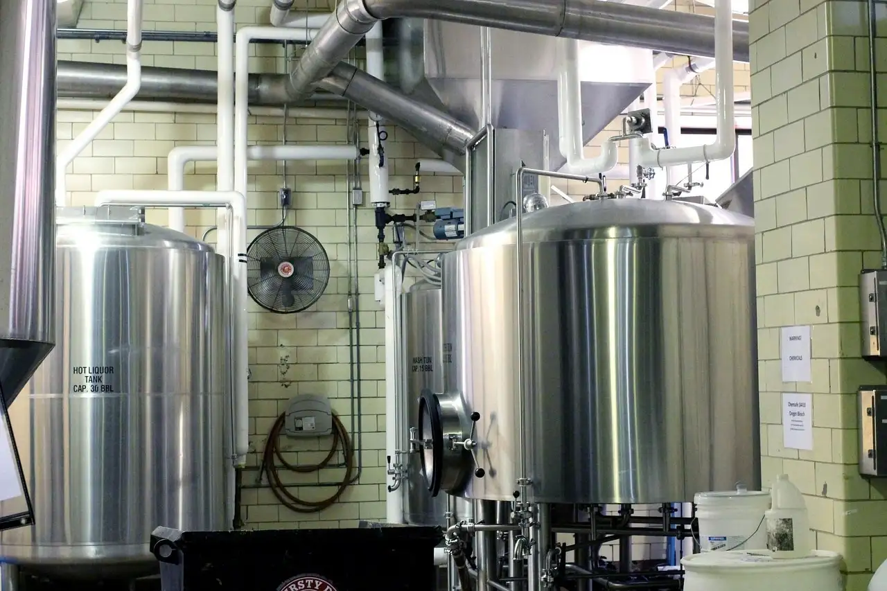 Steel brewing tanks and pipes in a small brewery