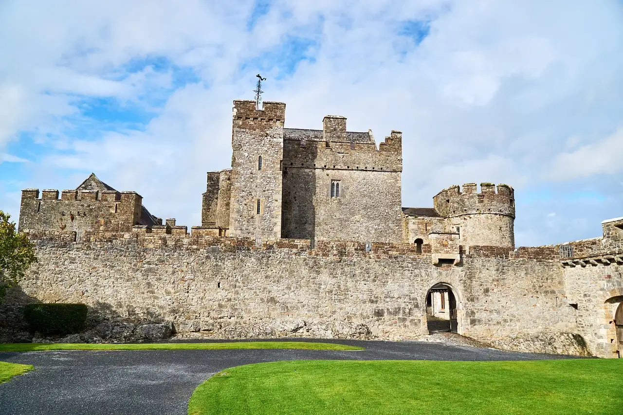 Cahir Castle, with its stone keep and walls behind a lawn