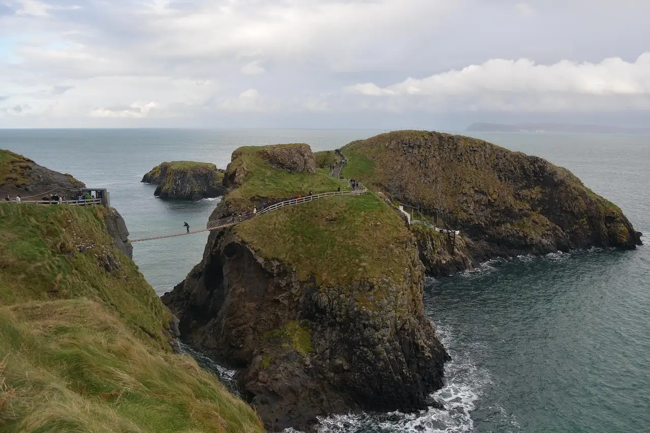 The Carrick-a-Rede rope bridge linking the cliffs to a small green island above the sea