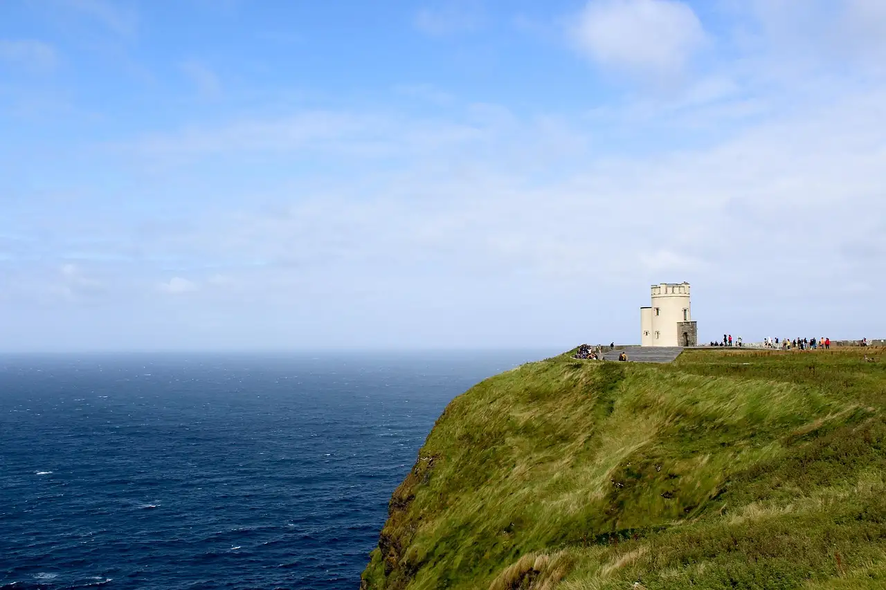 O'Brien's Tower on a green clifftop at the Cliffs of Moher, high above the sea