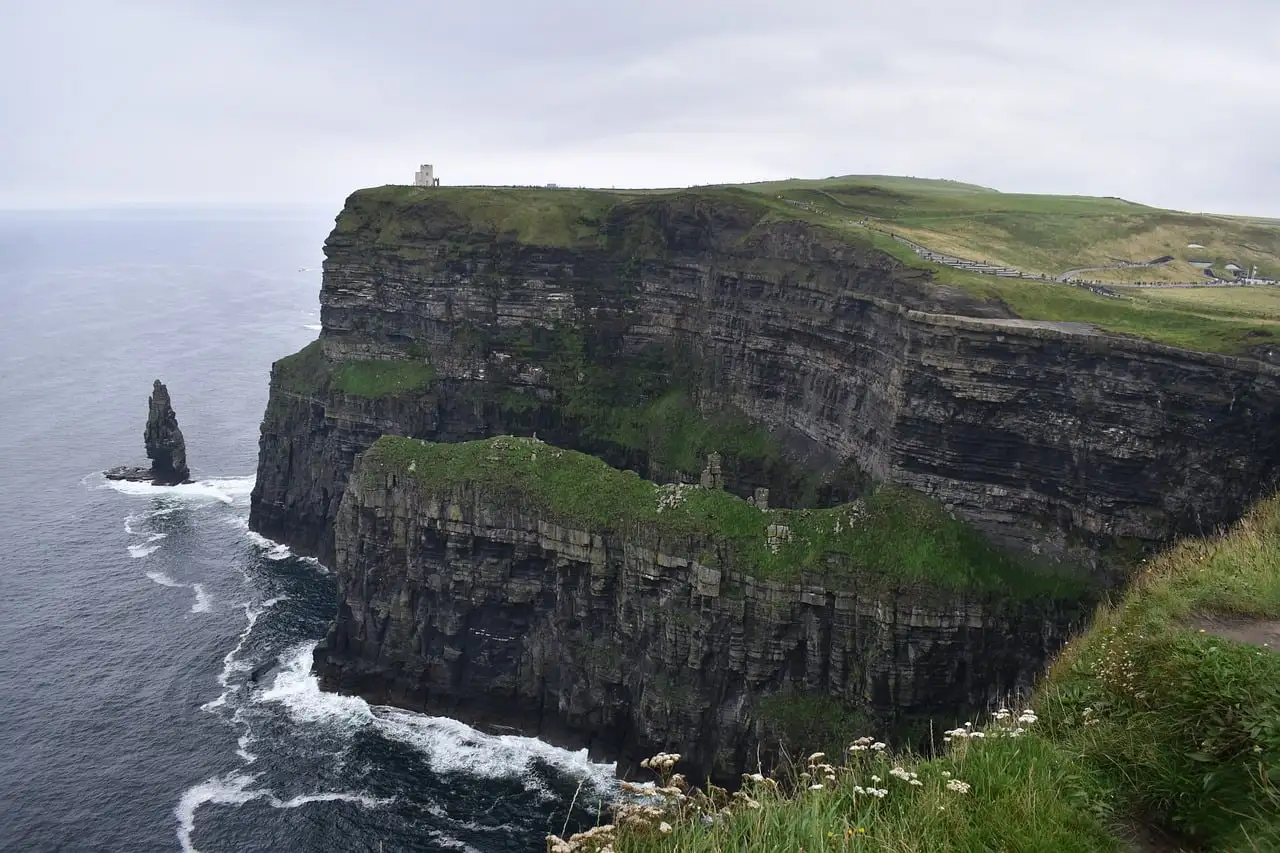 Green-topped cliffs and a tall sea stack at the Cliffs of Moher