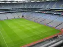 The empty stands and green pitch of Croke Park stadium in Dublin, seen from high in a stand