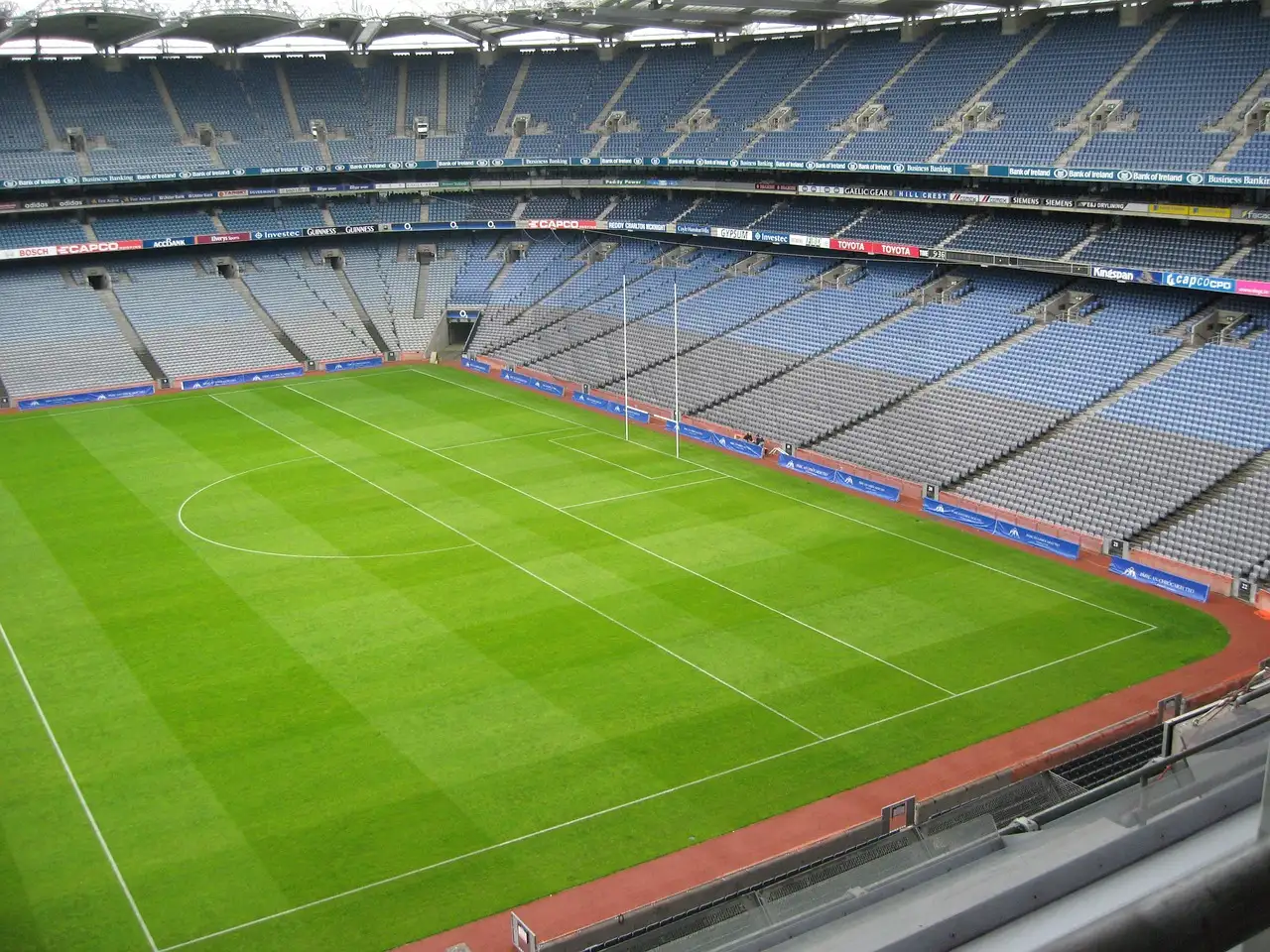 The empty stands and green pitch of Croke Park stadium in Dublin, seen from high in a stand