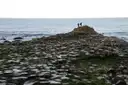 The stone columns of the Giant's Causeway running out to the sea