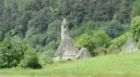 St Kevin's Church, a small stone church with a round belfry, in the green Glendalough valley
