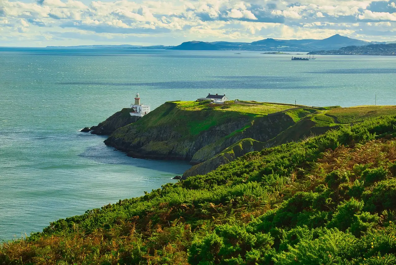 Howth Head with the Baily Lighthouse on a green point above Dublin Bay