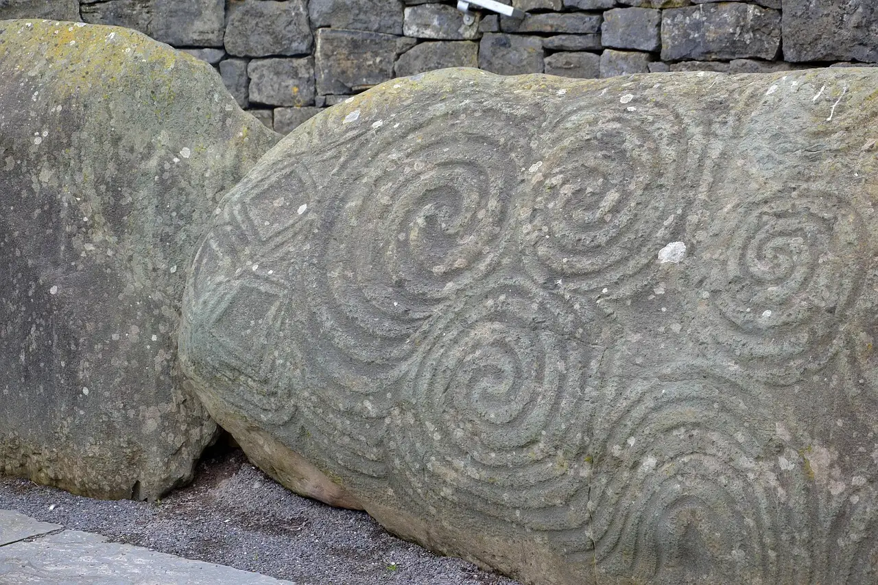 The large stone with carved spirals in front of the Newgrange entrance