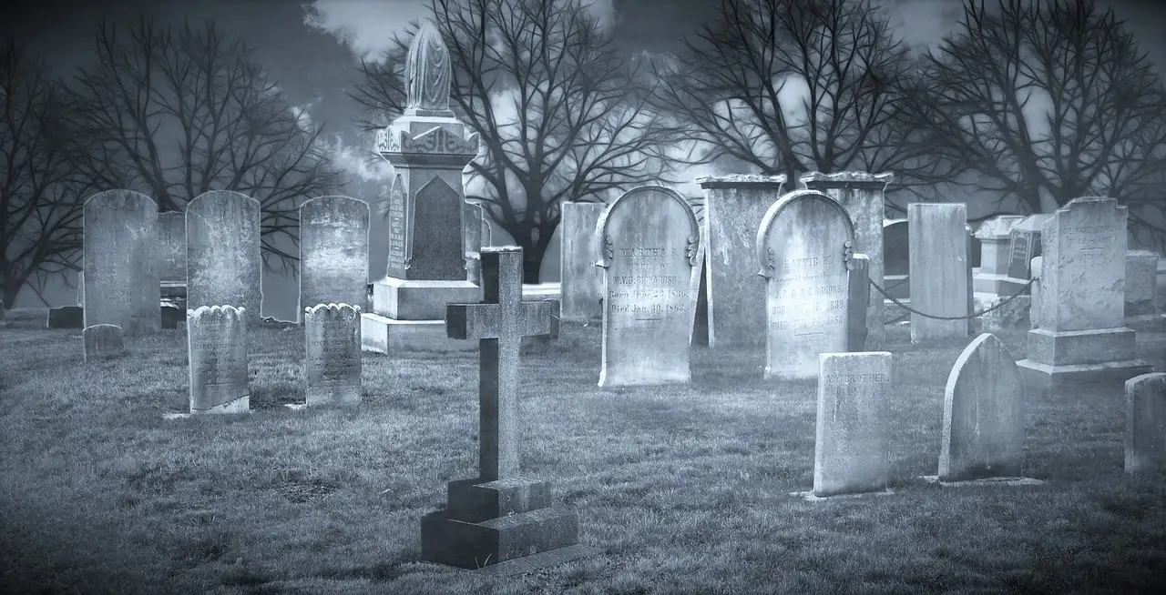 Old stone crosses and gravestones in a quiet graveyard