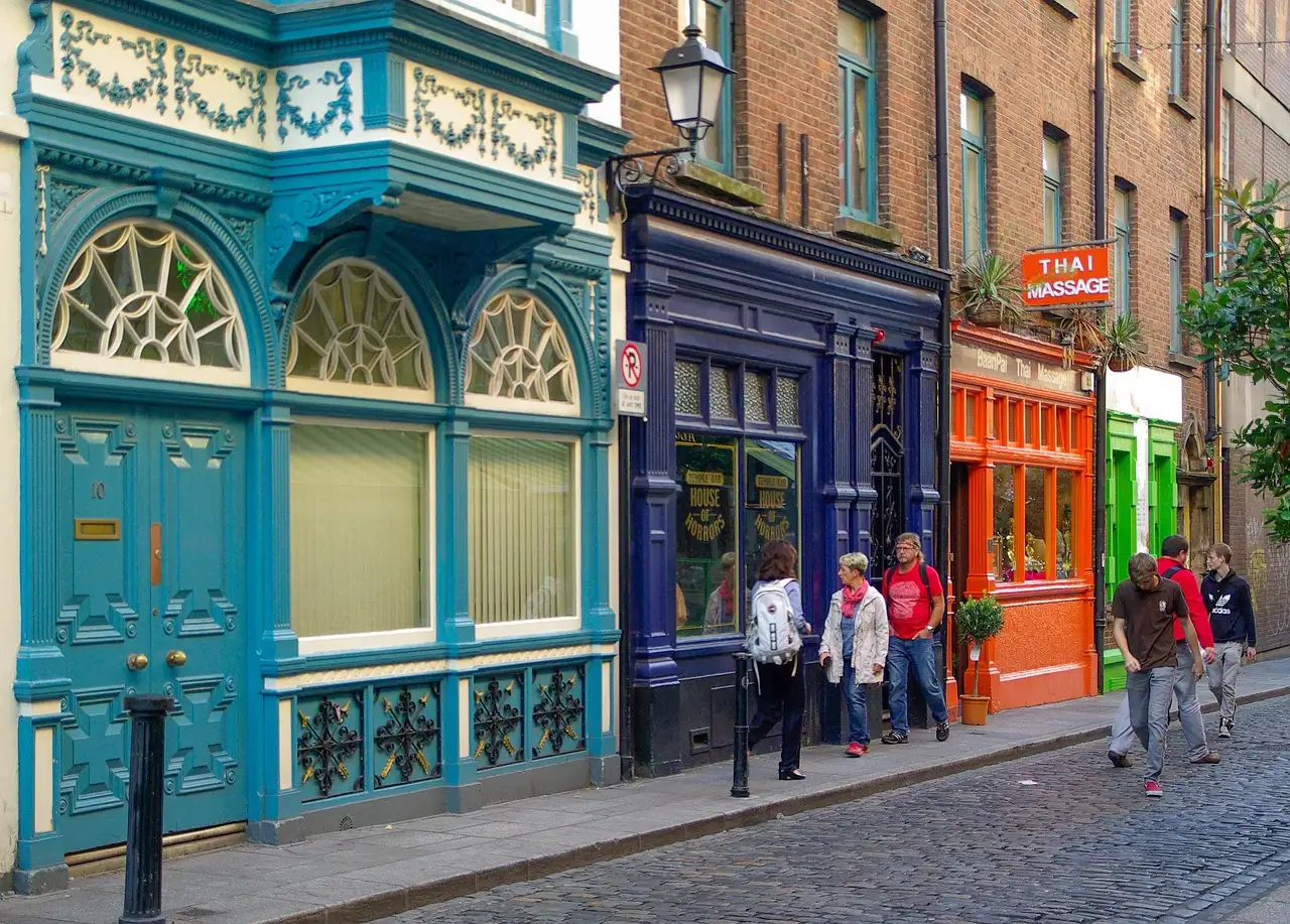 Colourful painted shopfronts on a cobbled Temple Bar street