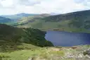 A lake in a green valley of the Wicklow Mountains