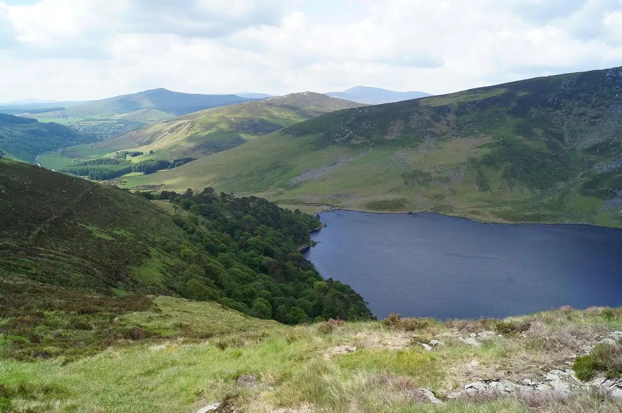 A lake in a green valley of the Wicklow Mountains